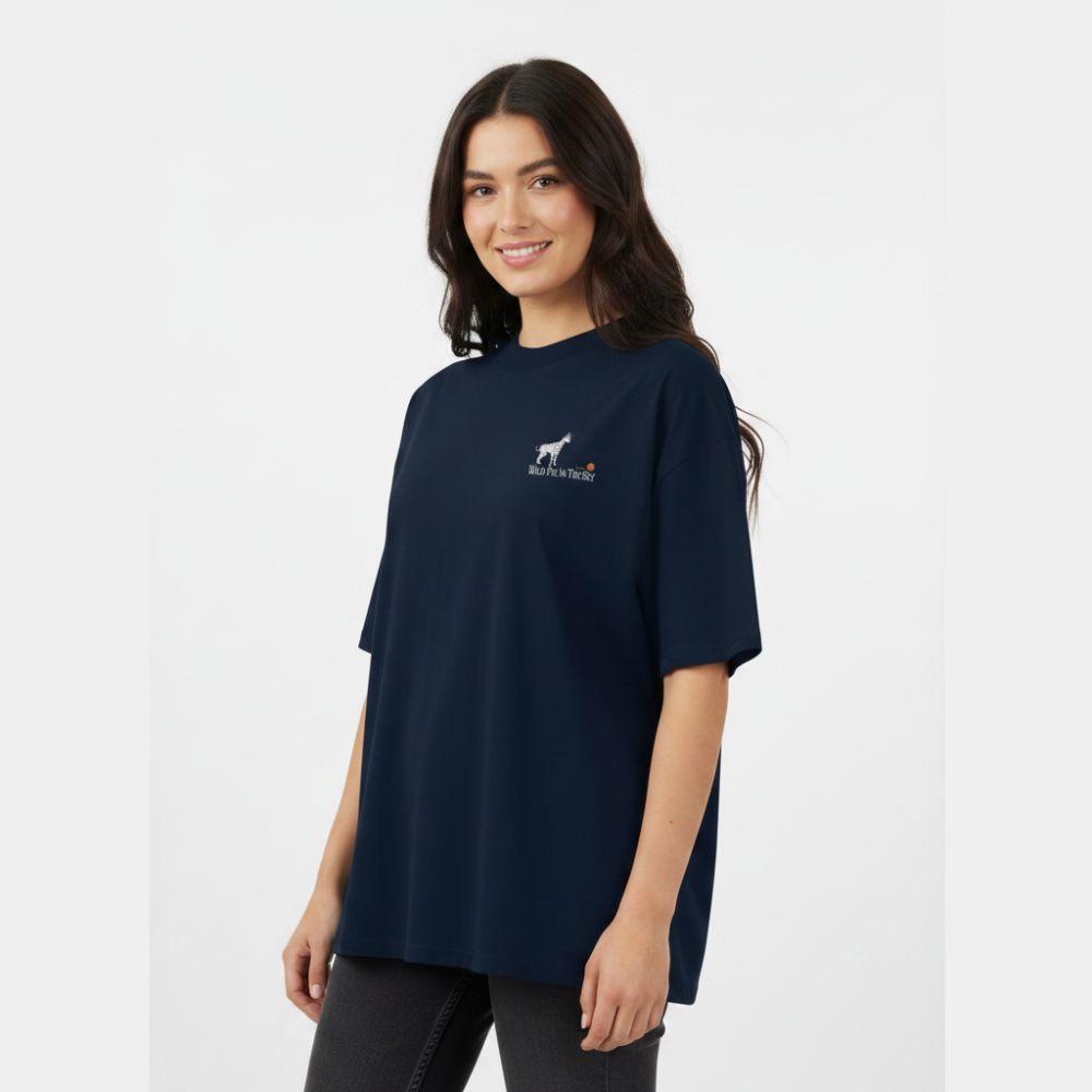 Oversized navy organic cotton unisex wildlife t-shirt featuring small serval cat chest graphic