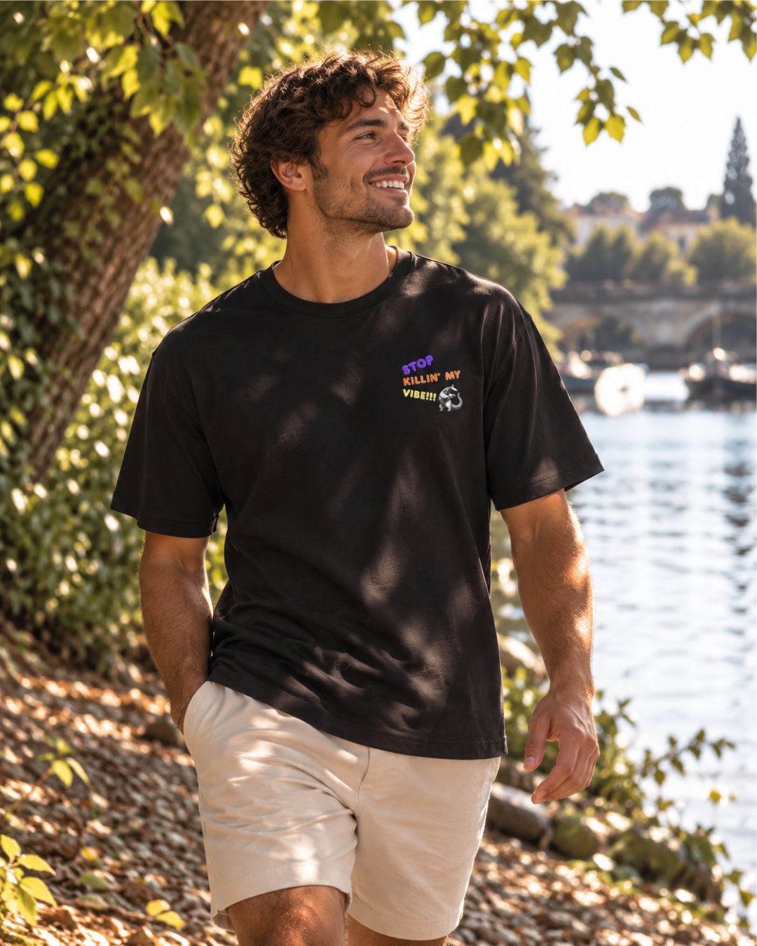 Oversized black organic cotton unisex wildlife t-shirt featuring a dancing aardvark graphic on the left chest