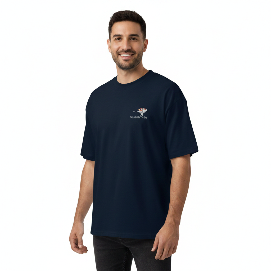 Oversized navy organic cotton unisex wildlife t-shirt featuring small  cheetah wearing a rocket chest graphic