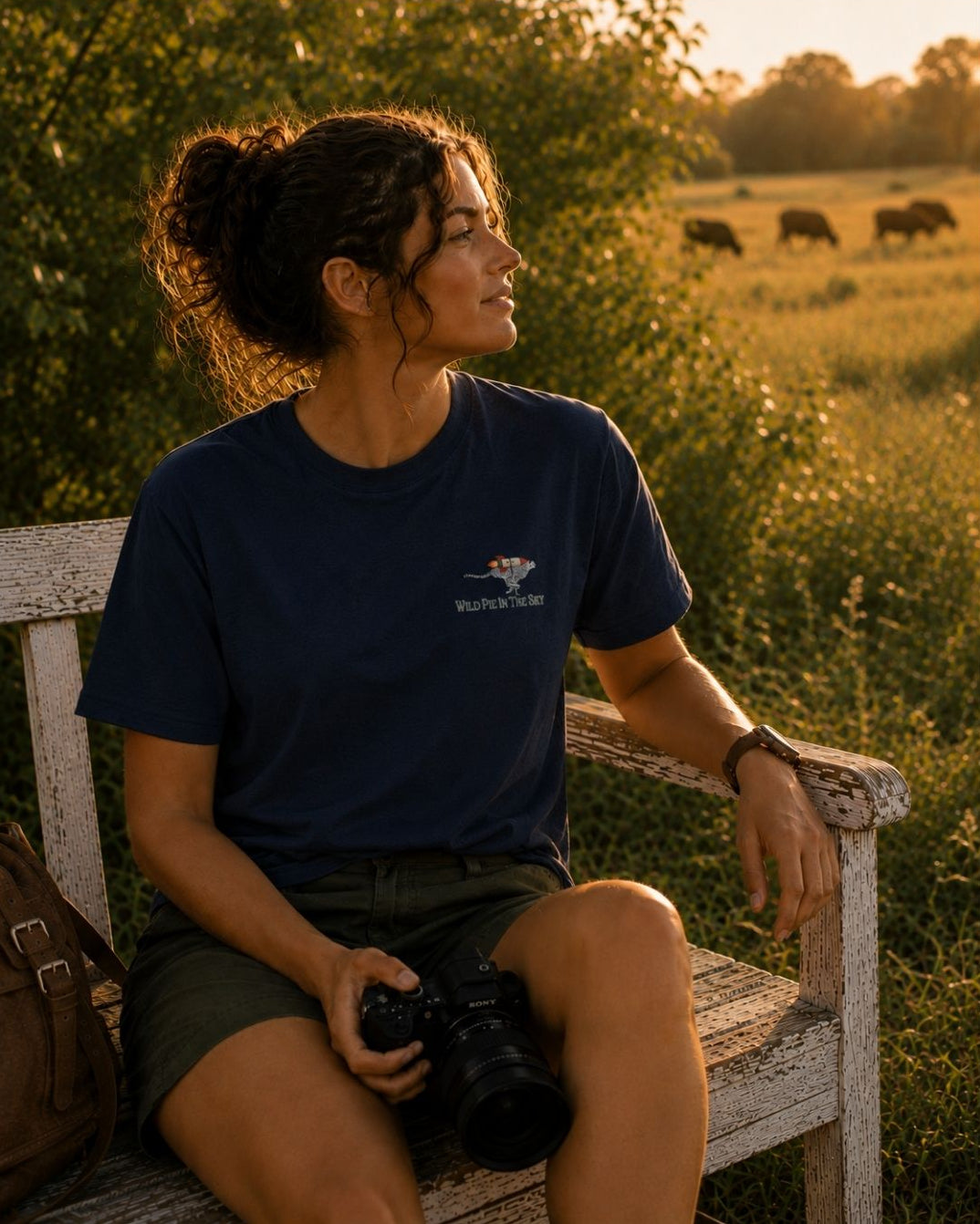 Oversized navy organic cotton unisex wildlife t-shirt featuring small  cheetah wearing a rocket chest graphic