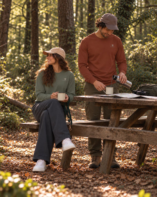 Unisex cotton long sleeve wildlife t-shirt featuring small  cheetah chest graphic shown in clay & cypress