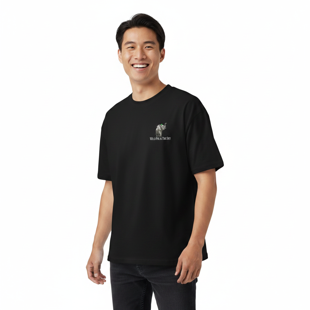 Oversized black organic cotton unisex wildlife t-shirt featuring small  elephant chest graphic