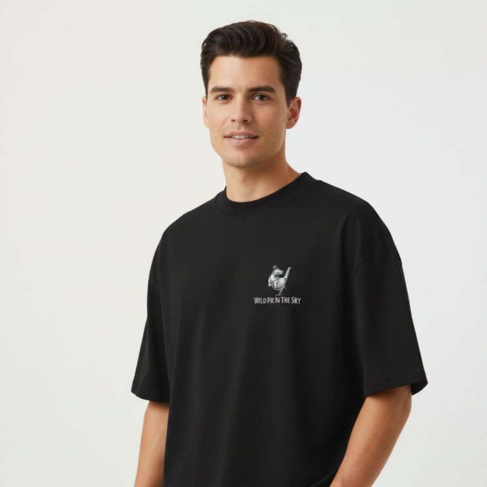 Oversized black organic cotton unisex wildlife t-shirt featuring small dancing hippo chest graphic