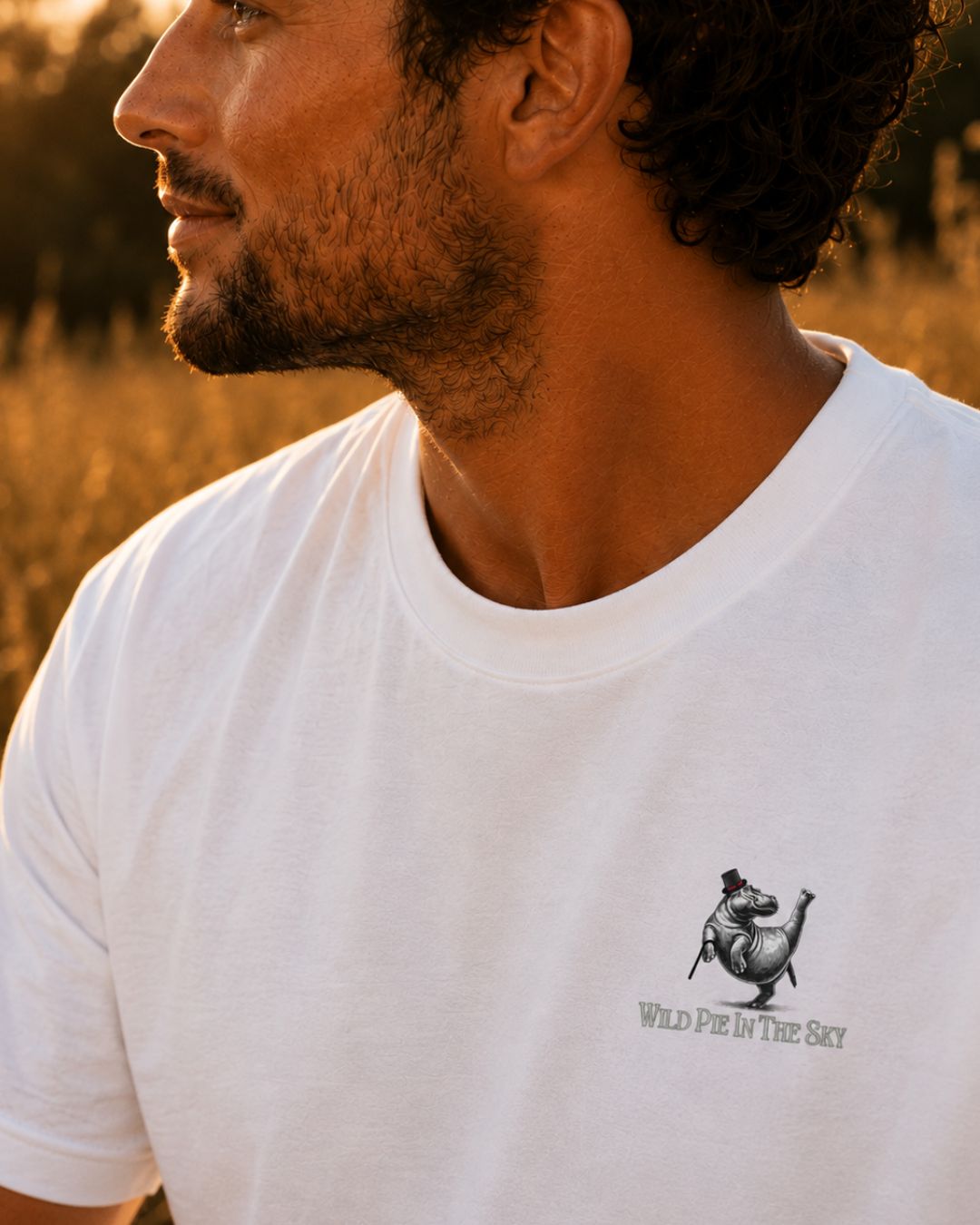 Oversized white organic cotton unisex wildlife t-shirt featuring small dancing hippo chest graphic