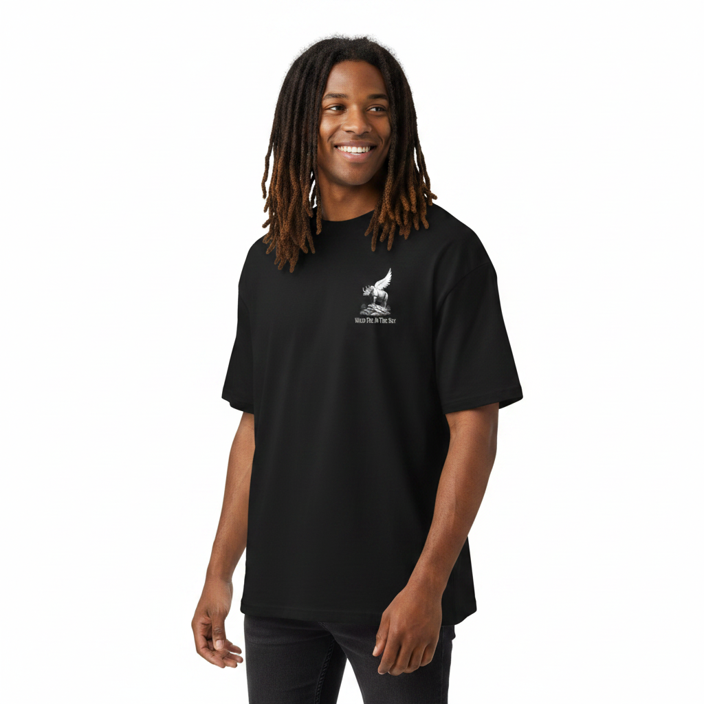 Oversized black organic cotton unisex wildlife t-shirt featuring small  winged rhino chest graphic