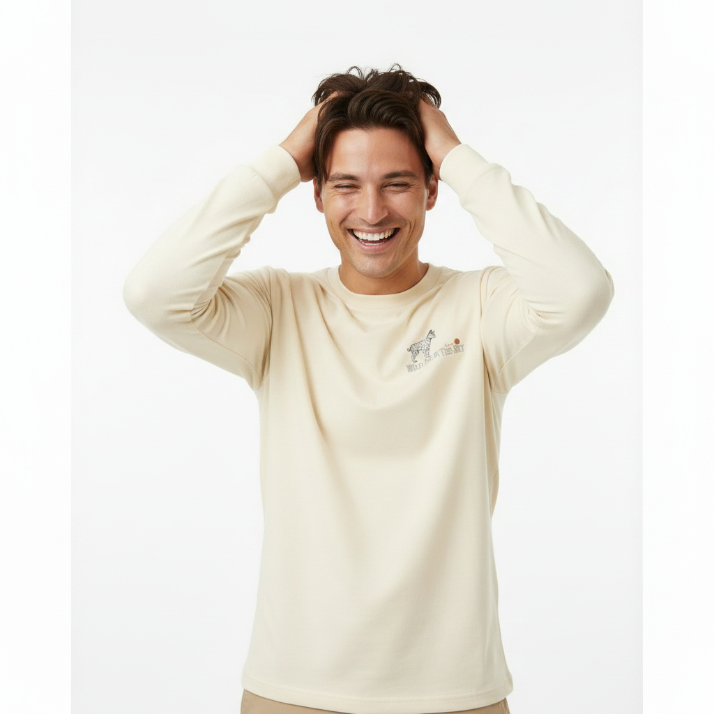 Ecru cotton long sleeve wildlife t-shirt featuring small serval cat chest graphic